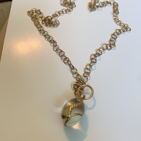 Gorgeous Friendly two golden Snake wrapped around an elongated oval crys…